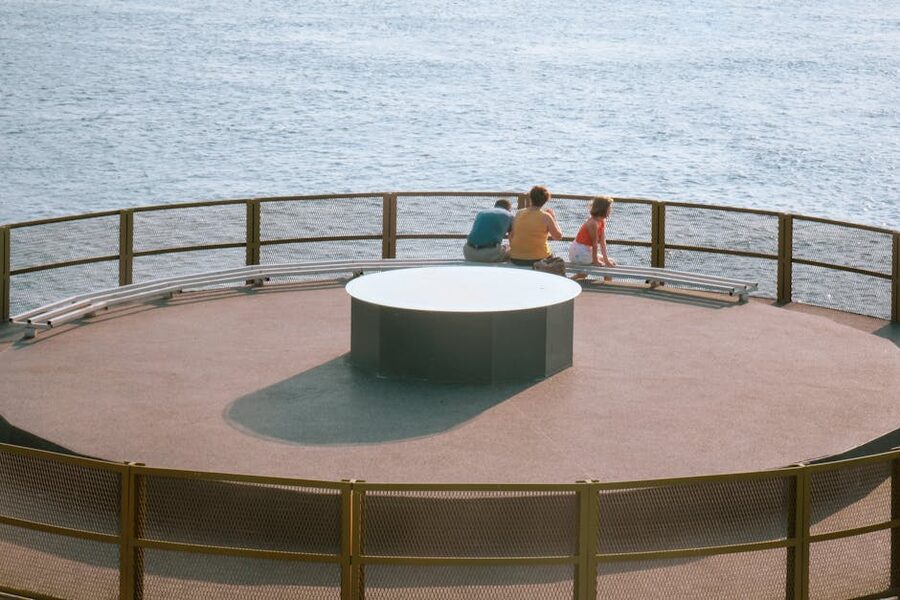 Family looking out over city from a viewpoint