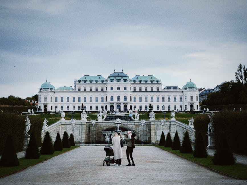 Family with children visiting a grand European palace