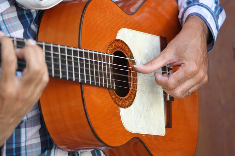 Flamenco guitarist hands close-up