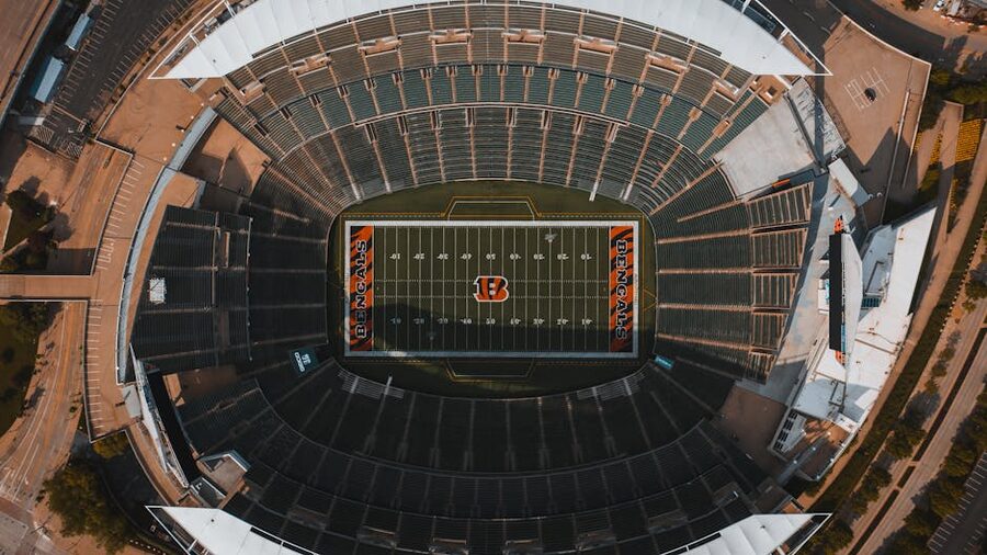 Empty football stadium seen from the top tier looking down at the pitch
