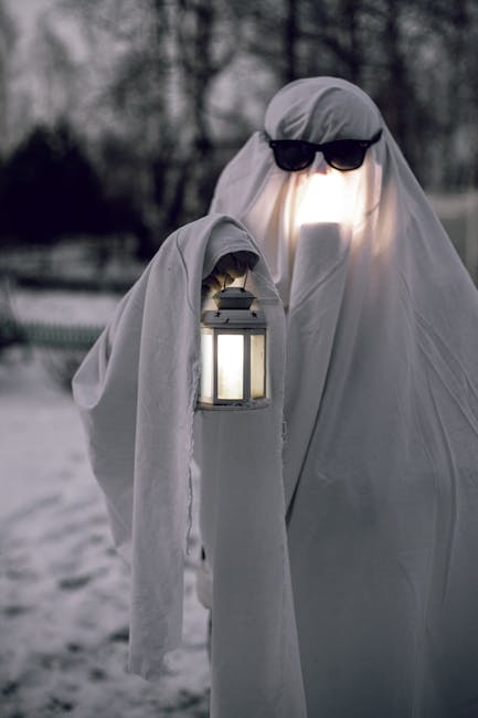 Atmospheric ghost tour lantern on dark street at night