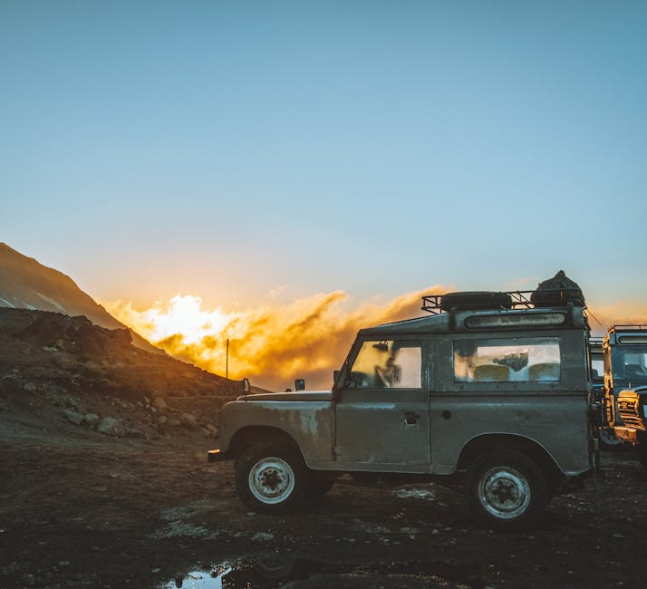 Jeep at sunset in rugged terrain