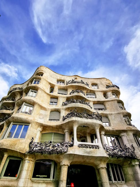 Undulating stone facade and iron balconies of La Pedrera