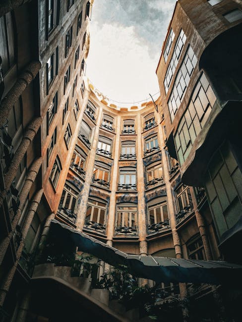 Interior courtyard of La Pedrera with curved walls and ornate ceilings