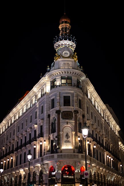 Gran Via street in Madrid illuminated at night with traffic and buildings