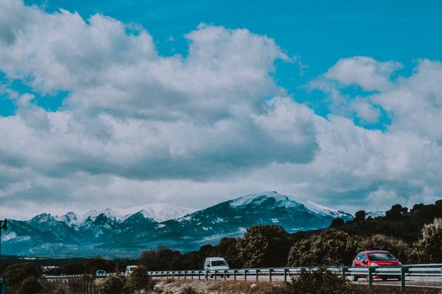 Road to mountains with snowy peaks near Madrid