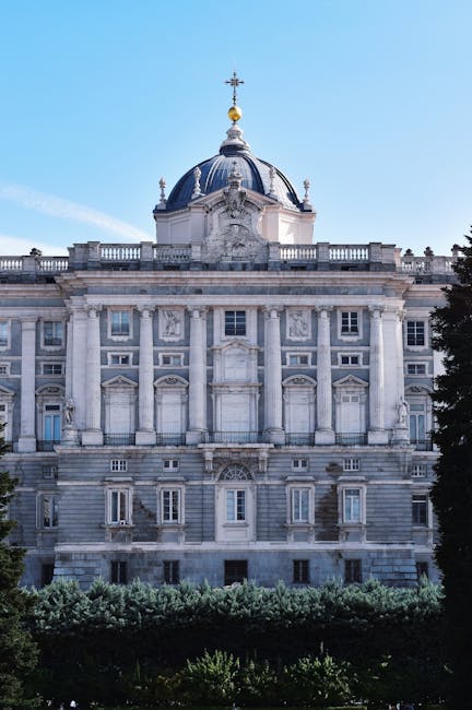 Royal Palace of Madrid seen from the plaza with blue sky