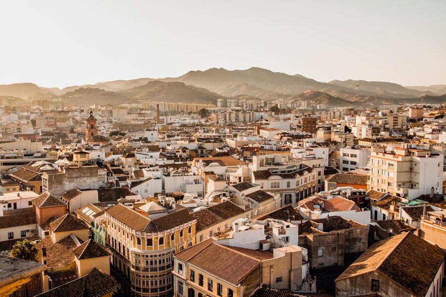 Malaga cityscape with mountains at sunset