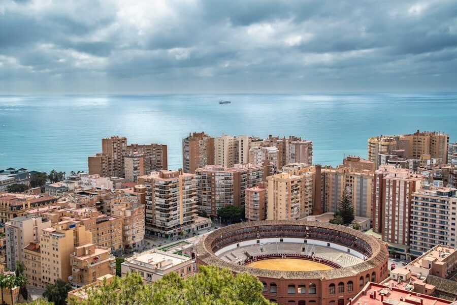 Malaga skyline with bullring and sea