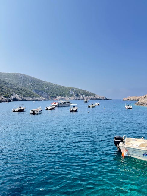 Boat anchored in a blue Mediterranean bay