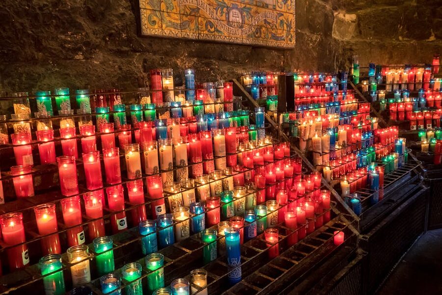 Rows of prayer candles inside a monastery church