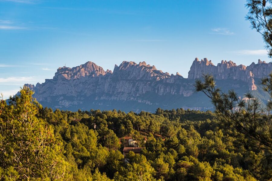 Dramatic serrated peaks of Montserrat mountain against sky