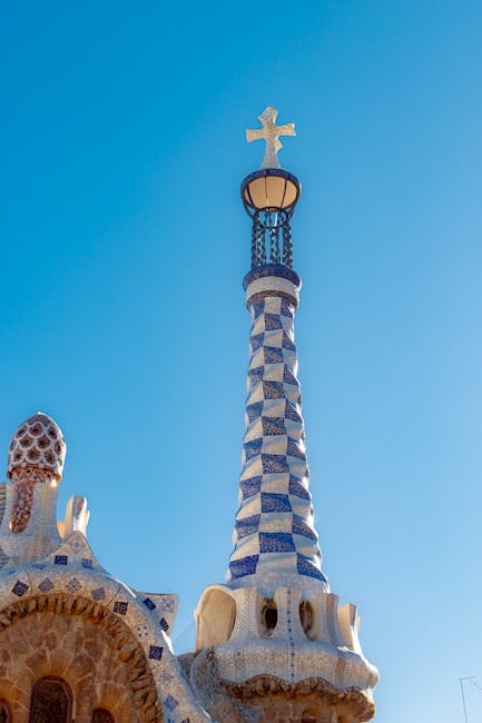 Colourful mosaic dragon sculpture at the entrance to Park Guell