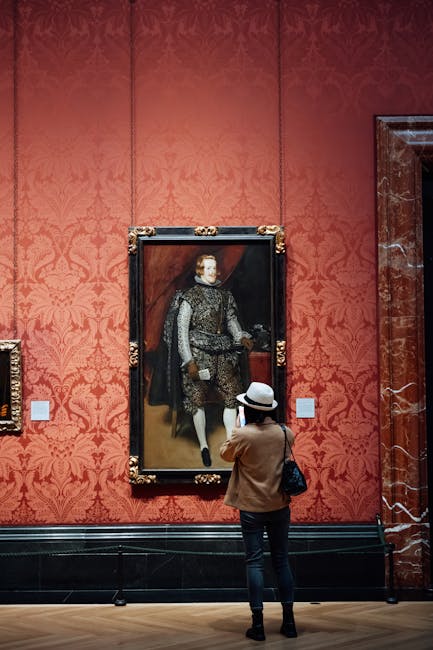 Renaissance portrait painting in ornate gold frame in museum