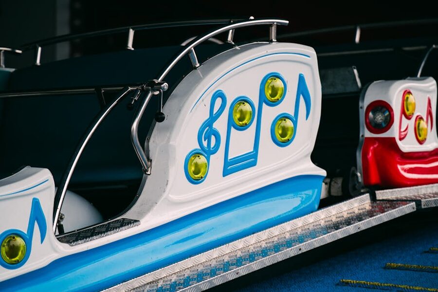 Children riding a small spinning cart ride at a theme park