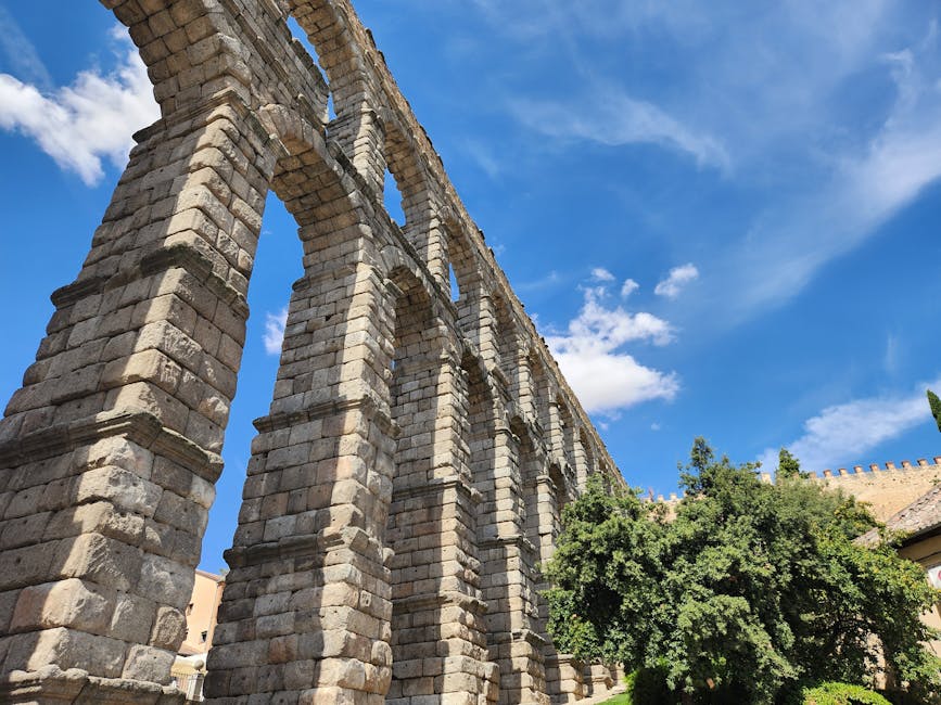 Ancient Roman aqueduct towering over Segovia Spain