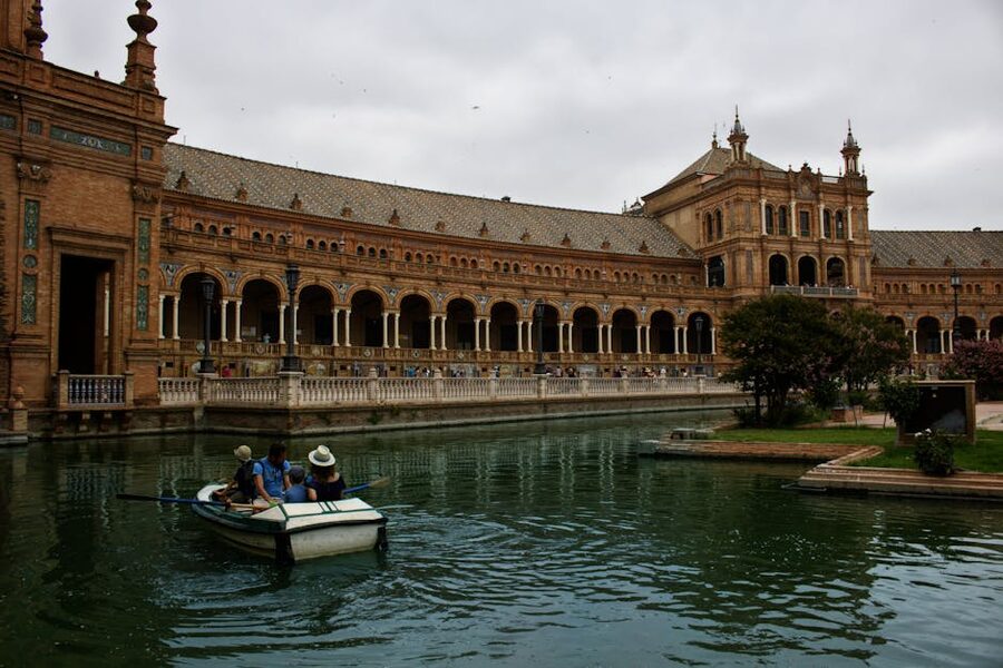 Tourists enjoying boat ride at Plaza de Espana