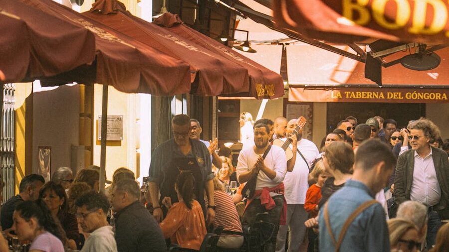 Outdoor taverna in Seville with musicians