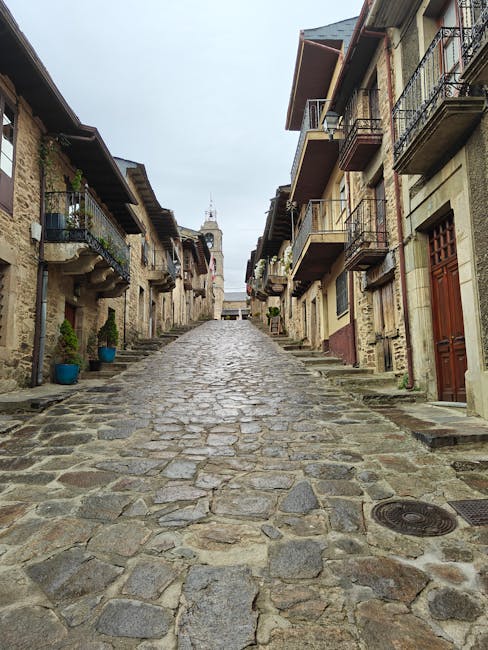 Cobblestone street through a medieval Spanish town