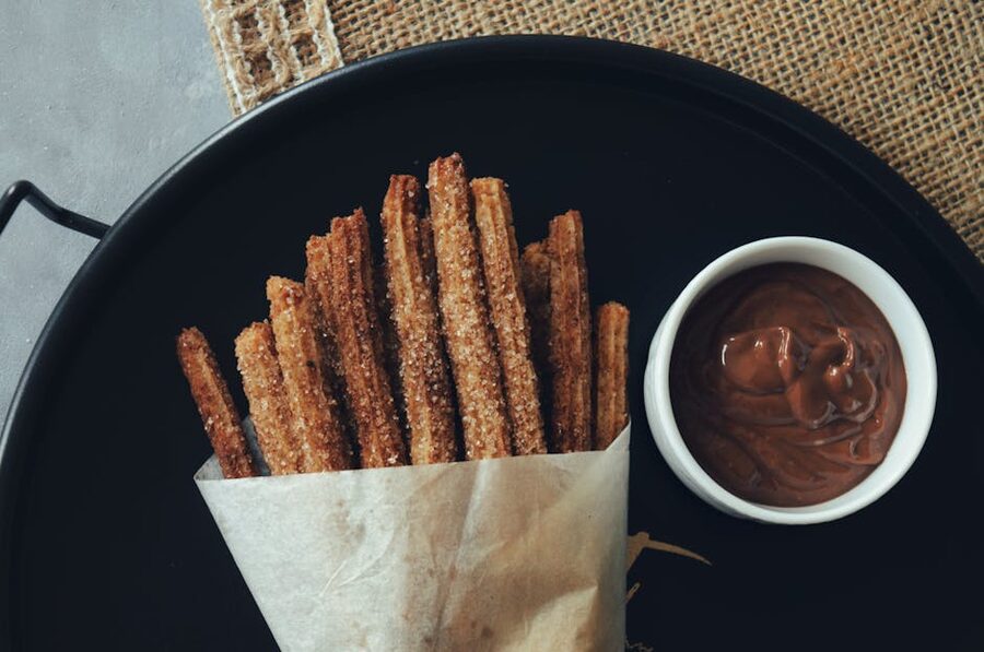 Traditional Spanish churros with a cup of thick hot chocolate