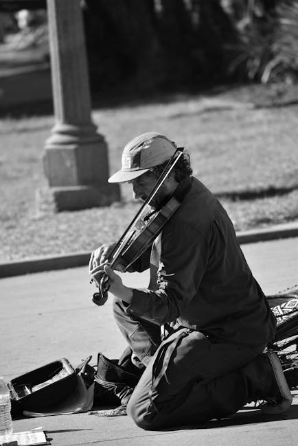 Street musician performing with guitar on European street