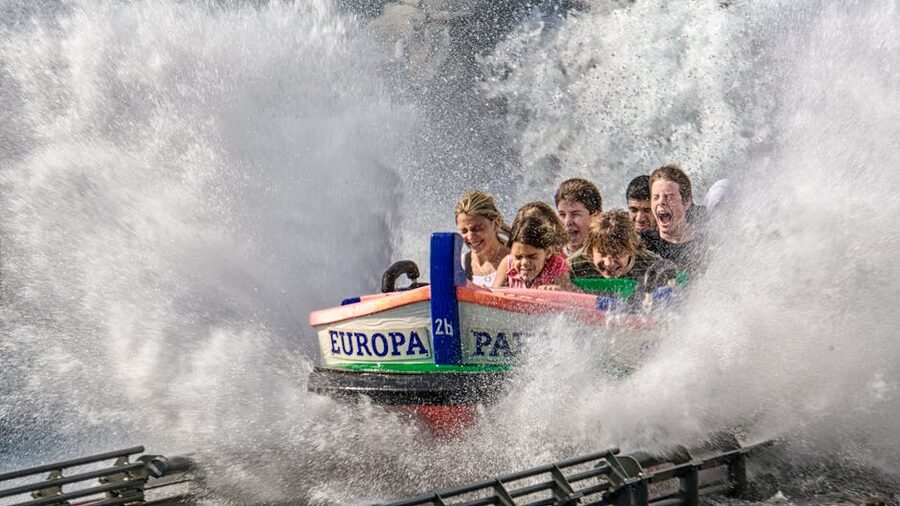 Log flume water ride splashing down at a theme park