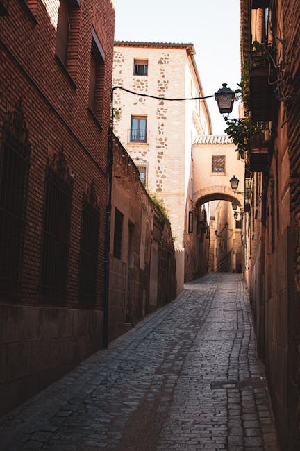 Narrow medieval stone street in the old town of Toledo
