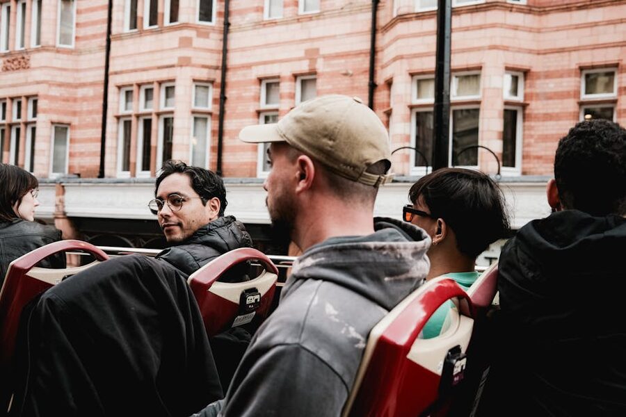 Tourists on open-top bus in city streets