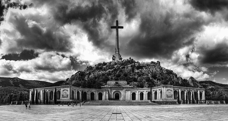 Valley of the Fallen cross on mountain ridge
