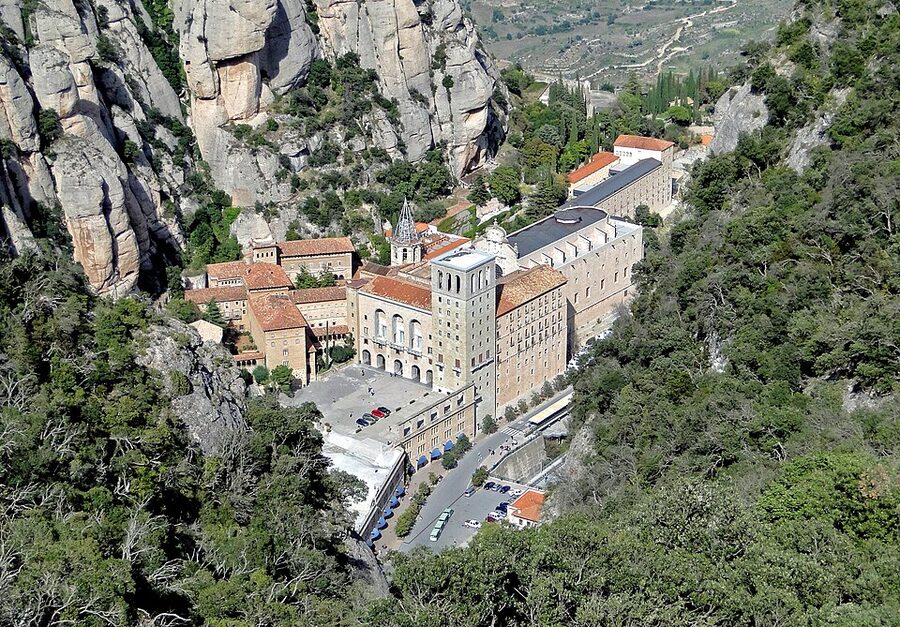 Exterior view of the Abbey of Montserrat against mountain rocks