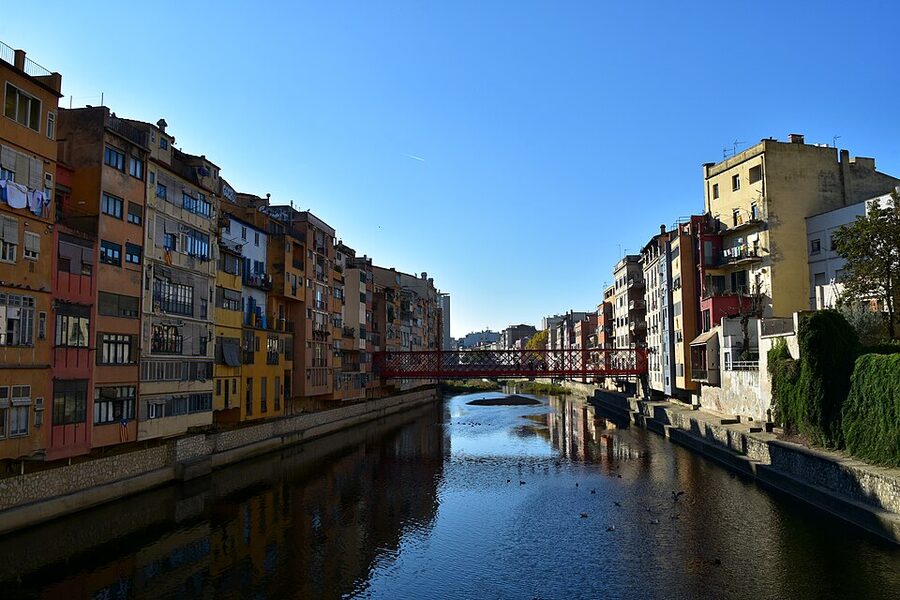 Colourful houses reflecting in the River Onyar Girona