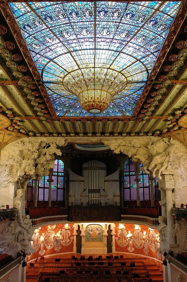 General interior view of Palau de la Musica showing stage and stained glass